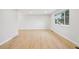 Bright, spacious living room with sleek wood floors and large windows for natural light at 9435 Osceola St, Westminster, CO 80031