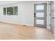 Bright living room featuring large windows, modern door and stylish grey trim at 9435 Osceola St, Westminster, CO 80031