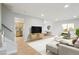 Inviting living room with hardwood floors and a seamless flow to the kitchen and dining area at 9435 Osceola St, Westminster, CO 80031
