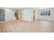 Open living room with new floors, stairway access, and ample space for furniture at 9435 Osceola St, Westminster, CO 80031