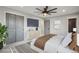 Spacious main bedroom with a ceiling fan, TV, walk-in closet and ensuite bathroom at 9435 Osceola St, Westminster, CO 80031