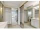 Bathroom view featuring double closets, sink, mirror, and toilet area at 14390 E Marina Dr # 601, Aurora, CO 80014
