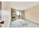 Bedroom with carpet, built-in shelves, and sliding glass doors to the balcony at 14390 E Marina Dr # 601, Aurora, CO 80014