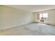Bright bedroom with a window and air conditioning unit at 14390 E Marina Dr # 601, Aurora, CO 80014