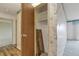 Hallway with closet featuring wood floors and floral wallpaper at 14390 E Marina Dr # 601, Aurora, CO 80014