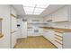 Functional kitchen with white cabinets and appliances at 14390 E Marina Dr # 601, Aurora, CO 80014