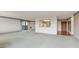 Open-concept living space with a view into the kitchen and access to a balcony at 14390 E Marina Dr # 601, Aurora, CO 80014