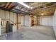 Unfinished basement area offering open space with built-in shelving and plenty of room for storage at 2608 S Troy Ct, Aurora, CO 80014