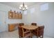 Charming breakfast nook features a cozy round table, built in cabinets, and good natural light at 2608 S Troy Ct, Aurora, CO 80014