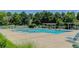Beautiful community pool with ample seating, surrounded by lush landscaping perfect for relaxation and recreation at 2608 S Troy Ct, Aurora, CO 80014
