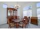 Dining room with hutch, chandelier, natural light, and a traditional dining set at 2608 S Troy Ct, Aurora, CO 80014