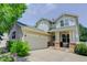 Charming two-story home with attached two car garage and inviting front porch at 2608 S Troy Ct, Aurora, CO 80014