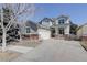 Charming two-story home with a well-manicured front yard and spacious driveway at 2608 S Troy Ct, Aurora, CO 80014