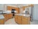 Bright kitchen with lots of counterspace and cabinets, stainless steel appliances and functional island at 2608 S Troy Ct, Aurora, CO 80014