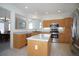 Bright kitchen featuring stainless steel appliances, central island, ample countertop space and breakfast area at 2608 S Troy Ct, Aurora, CO 80014