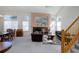 Bright living room featuring a fireplace, staircase, vaulted ceilings and lots of natural light at 2608 S Troy Ct, Aurora, CO 80014