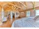 Bright bedroom with vaulted wood ceilings, closet, and en suite bathroom filled with natural light at 1057 Reed Ranch Rd, Boulder, CO 80302