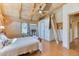 Cozy bedroom with wood paneled walls and ceiling, ladder leading to loft space, and a ceiling fan at 1057 Reed Ranch Rd, Boulder, CO 80302