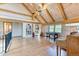 Upper bonus room featuring hardwood floors, vaulted ceilings, built-in shelves and foosball table at 1057 Reed Ranch Rd, Boulder, CO 80302