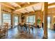 Bright dining area features wood beams, natural light, and stylish light fixture at 1057 Reed Ranch Rd, Boulder, CO 80302