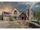 Beautiful exterior of a home featuring solar panels and a cozy seating area in a tranquil, tree-filled setting at 1057 Reed Ranch Rd, Boulder, CO 80302