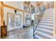 Grand foyer showcasing an open floor plan, staircase and slate flooring at 1057 Reed Ranch Rd, Boulder, CO 80302