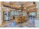 Eat-in kitchen with a large island, modern appliances and custom pendant lighting at 1057 Reed Ranch Rd, Boulder, CO 80302