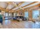 Spacious living area with wood accents, large windows, and seamless flow to dining space at 1057 Reed Ranch Rd, Boulder, CO 80302