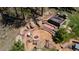 Relaxing outdoor area with a hot tub, chairs around a fire pit, and natural rock elements for a serene escape at 1057 Reed Ranch Rd, Boulder, CO 80302