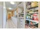 Walk-in pantry featuring shelving, storage cabinets, and a countertop area for organization at 1057 Reed Ranch Rd, Boulder, CO 80302