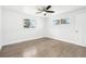 Spacious bedroom filled with natural light, featuring hardwood floors and ceiling fan at 224 Agate Way, Broomfield, CO 80020