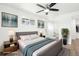 Bright main bedroom with a modern ceiling fan and an ensuite bathroom at 224 Agate Way, Broomfield, CO 80020