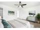 This spacious bedroom is virtually staged to show the scale of the room with nice artwork at 224 Agate Way, Broomfield, CO 80020