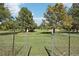 View of a park featuring wide open space with green grass and tall trees at 224 Agate Way, Broomfield, CO 80020