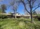 Expansive backyard with lawn, trees, storage shed and patio, perfect for outdoor enjoyment at 12682 W Louisiana Ave, Lakewood, CO 80228