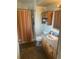 Classic bathroom with a shower, a toilet, a vanity with storage, and neutral decor at 12682 W Louisiana Ave, Lakewood, CO 80228