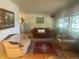 Cozy living room featuring neutral walls, plush furniture, an area rug, and bright natural lighting at 12682 W Louisiana Ave, Lakewood, CO 80228