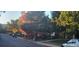 Picturesque street with lush, mature trees displaying vibrant fall foliage at 12682 W Louisiana Ave, Lakewood, CO 80228