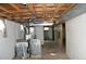 Unfinished basement showing the laundry area and mechanicals, ready for customization at 6363 County Road 20, Longmont, CO 80504