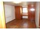 Bedroom featuring built-in wardrobes and a vanity with hardwood floors at 6363 County Road 20, Longmont, CO 80504