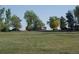 Charming home on a large lot, surrounded by mature trees and lush greenery, perfect for peaceful living at 6363 County Road 20, Longmont, CO 80504