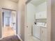 Laundry area with washer, dryer, and cabinets at 199 Quebec St # M, Denver, CO 80220