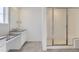 Bathroom with modern vanity, large mirror and glass enclosed walk-in shower at 39896 Floyd St, Elizabeth, CO 80107