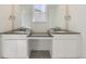 Bathroom with double sink vanity and framed mirrors at 39896 Floyd St, Elizabeth, CO 80107