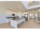 Modern kitchen with stainless steel appliances, white cabinets, and an island with a sink at 39896 Floyd St, Elizabeth, CO 80107