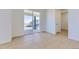 Spacious and airy living area featuring hardwood-style flooring and sliding glass door to back deck at 39896 Floyd St, Elizabeth, CO 80107