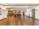 Spacious basement recreation area with pool table and hardwood floors at 10385 Grande Vista Ct, Lone Tree, CO 80124