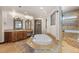 Elegant bathroom with soaking tub, double vanity, and walk-in shower at 10385 Grande Vista Ct, Lone Tree, CO 80124