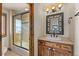 Bathroom with a vanity, mirror, and shower/tub combo at 10385 Grande Vista Ct, Lone Tree, CO 80124