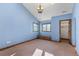 Light blue bedroom with vaulted ceiling, window seat, and walk-in closet at 10385 Grande Vista Ct, Lone Tree, CO 80124